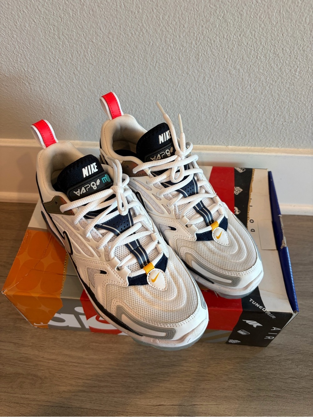Nike Men’s White Athletic Sneakers with Navy & Red Accents